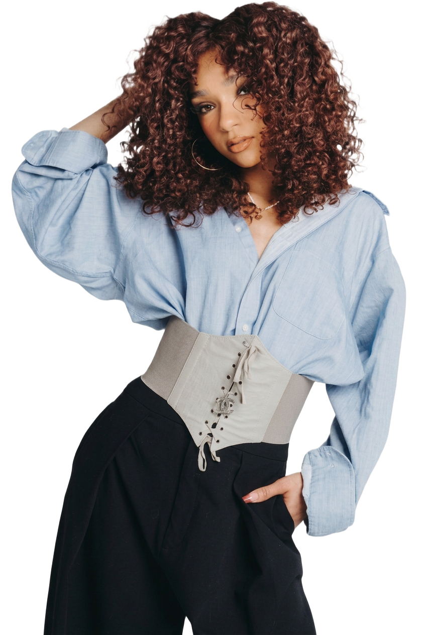 Shar in a blue shirt with her natural curls